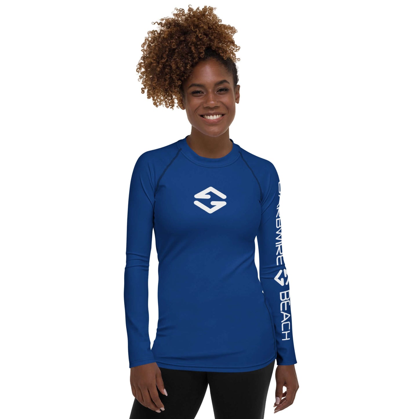 Model wearing Women's Rash Guard in Signature Blue with long sleeves and Barbwire Beach logo.