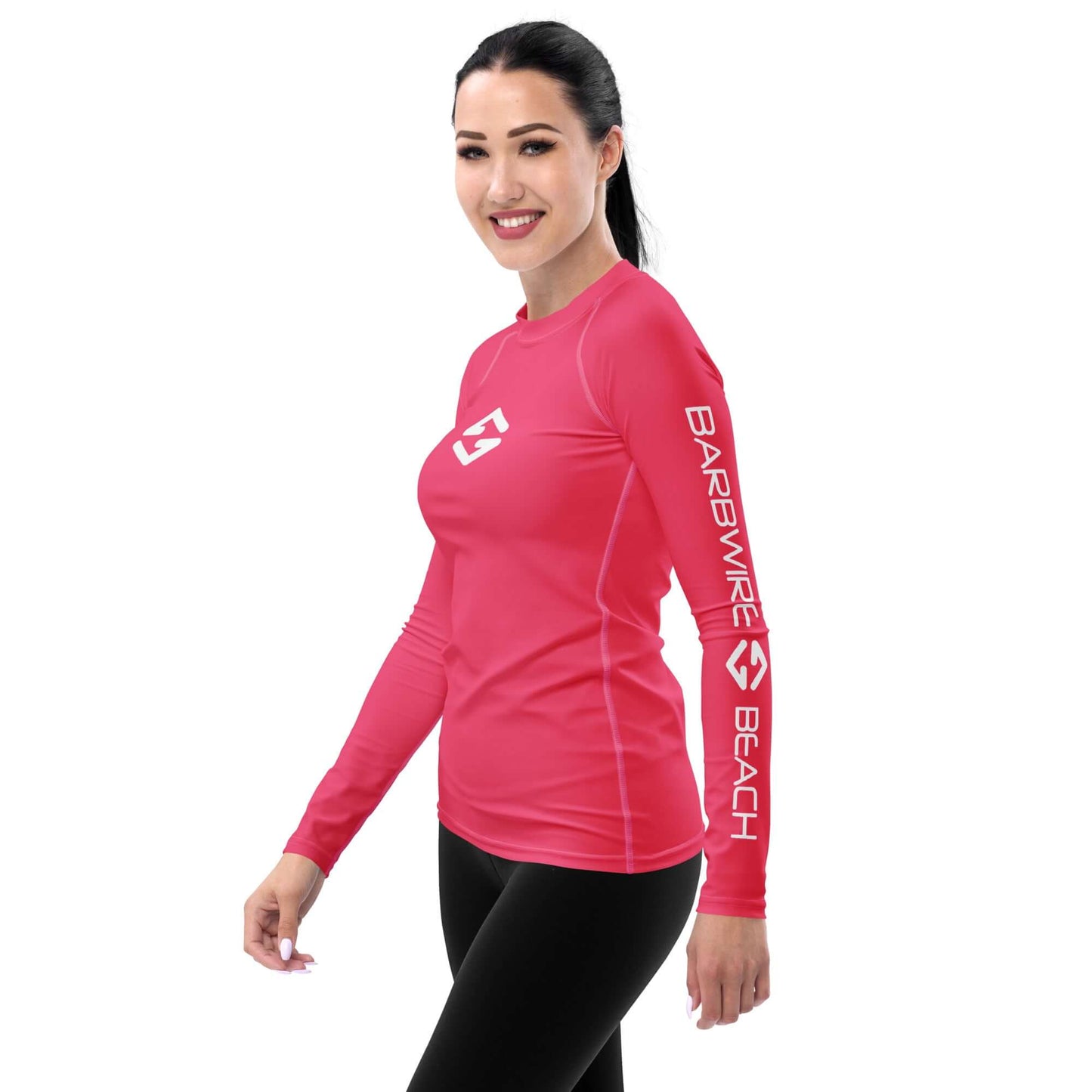 Women's Rash Guard in pink, designed for sun protection, perfect for surfing and outdoor activities.