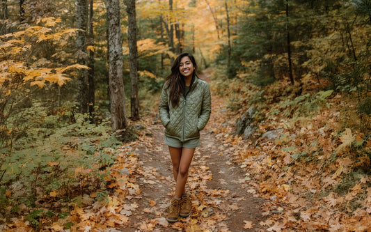 Woman walking on a path in a forest during autumn Women's Puffer Jacket – Everest Quilted Jacket | Barbwire Beach