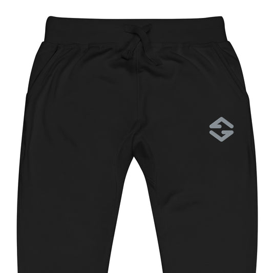 Unisex fleece sweatpants in black with soft fabric, elastic waistband, and relaxed fit black close up