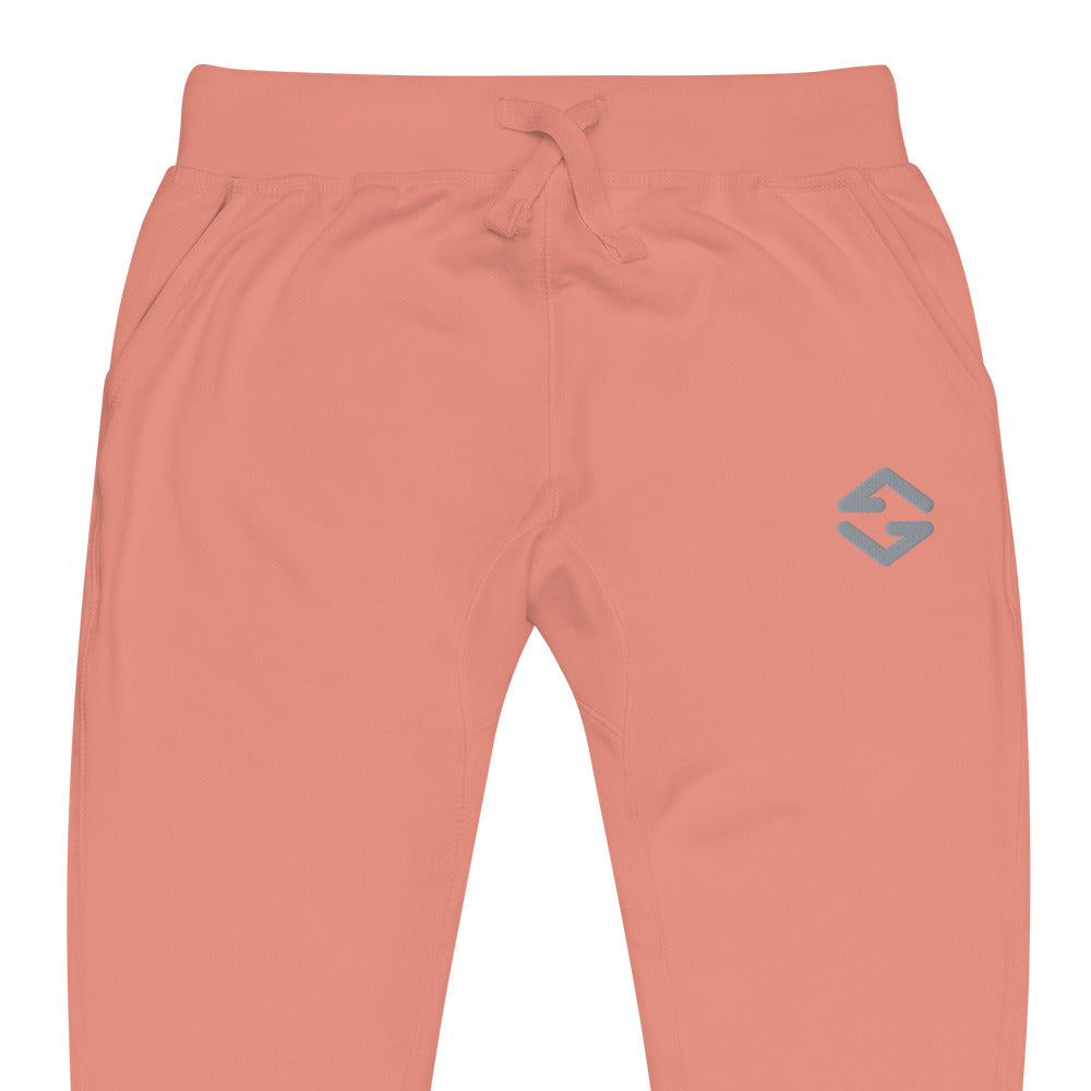 Unisex fleece sweatpants in black with soft fabric, elastic waistband, and relaxed fit peach close up