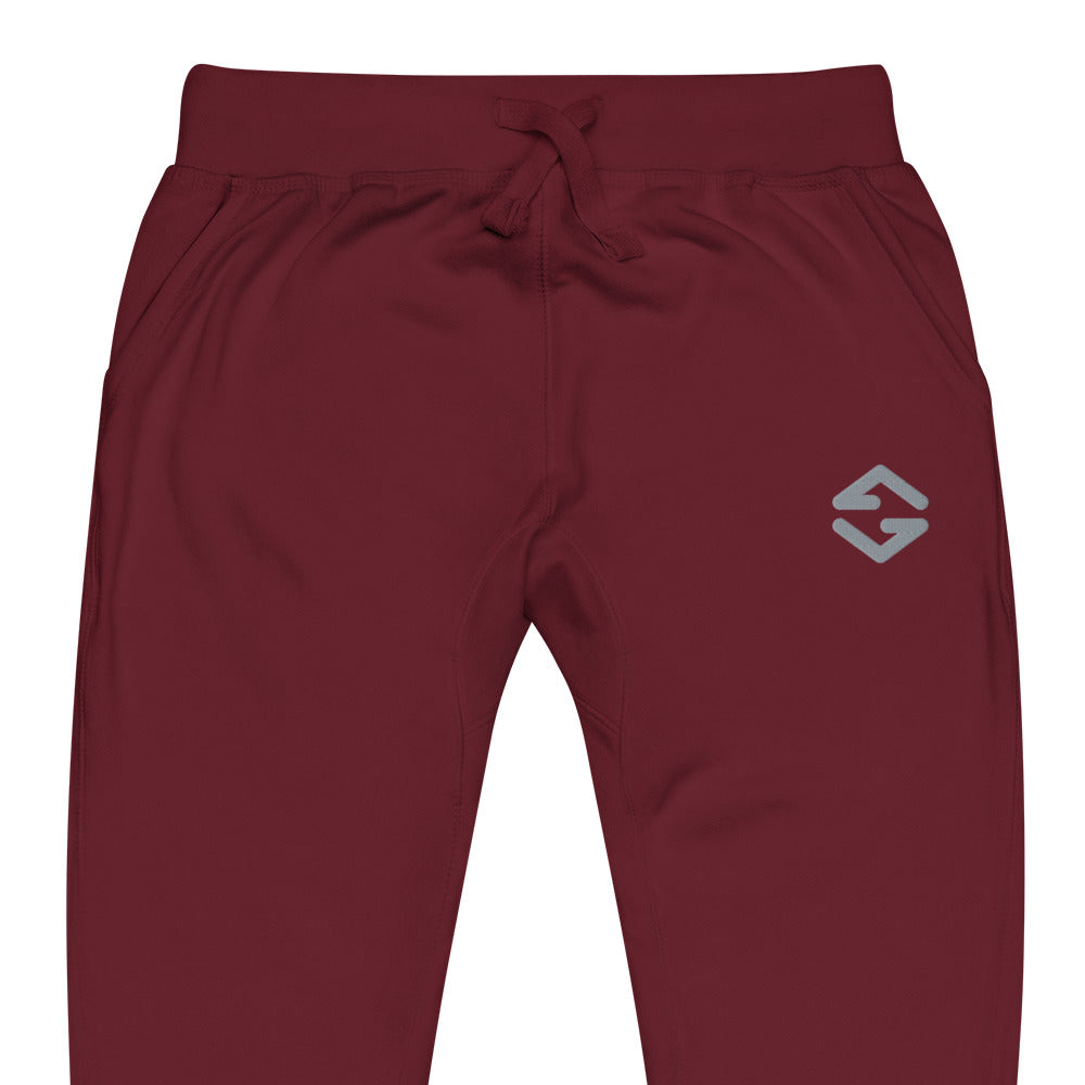 Unisex fleece sweatpants in black with soft fabric, elastic waistband, and relaxed fit red close up