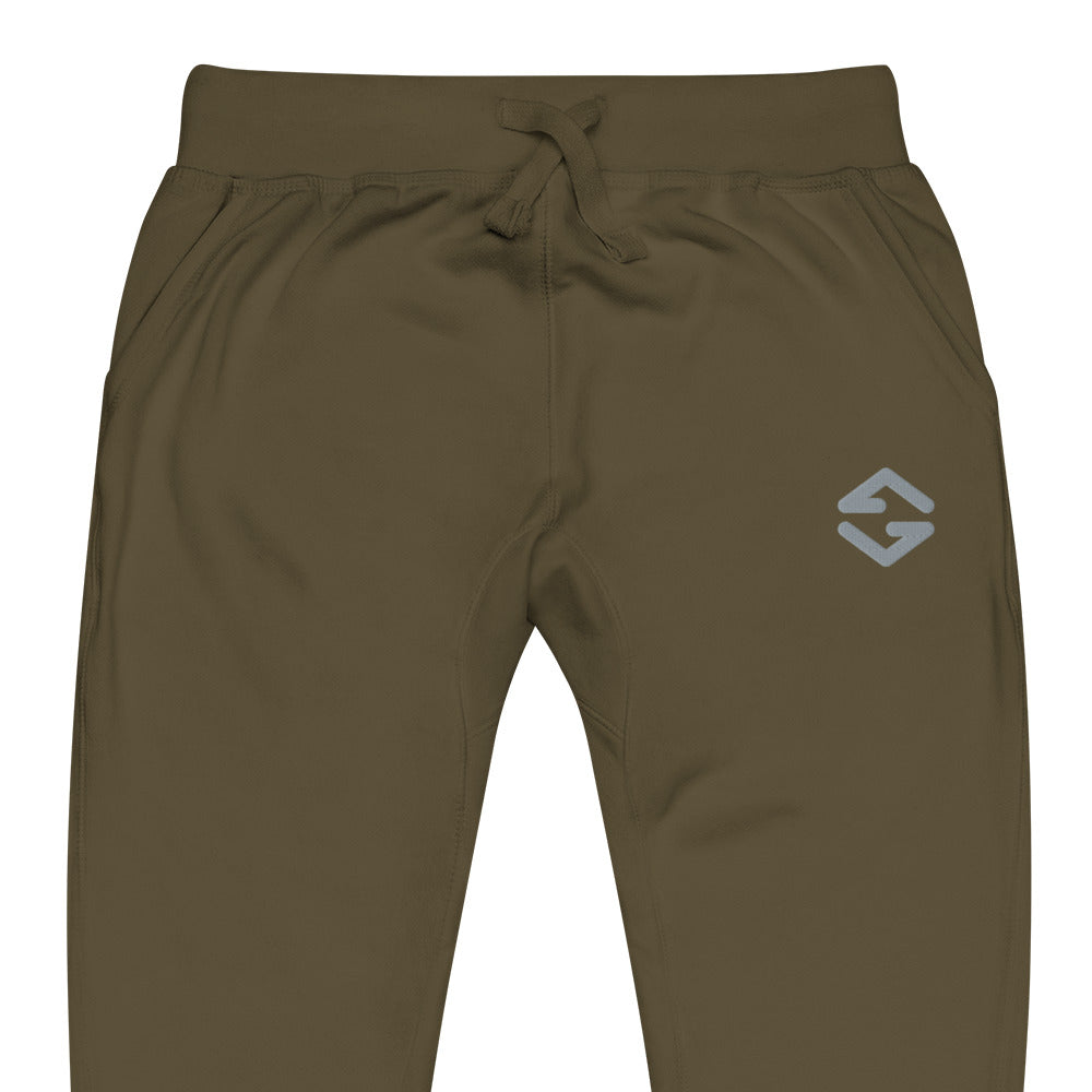 Unisex fleece sweatpants in black with soft fabric, elastic waistband, and relaxed fit green close up
